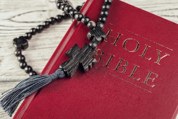 Photo bible and a crucifix on an old wooden table