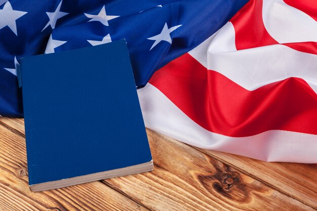 Bible laying on top of an american flag