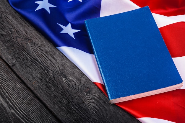 Bible laying on top of an american flag