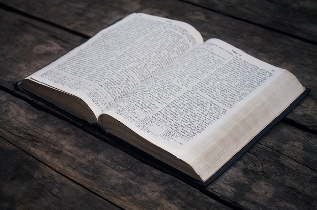 Bible on a wooden desk.