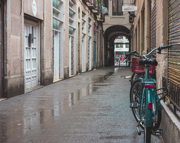 Bicycle blue on city street rainy day