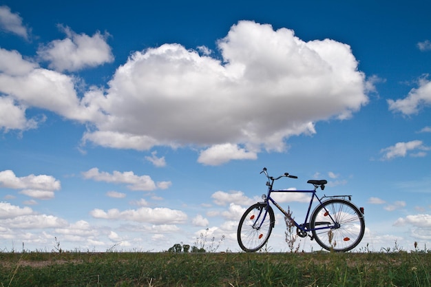 Bicycle on field against sky