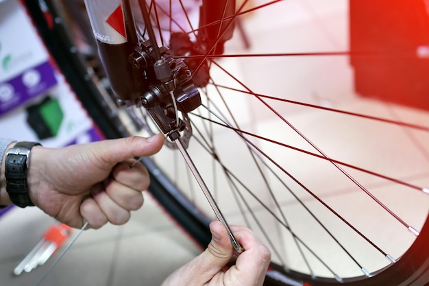 Bicycle mechanic in a workshop in the repair process