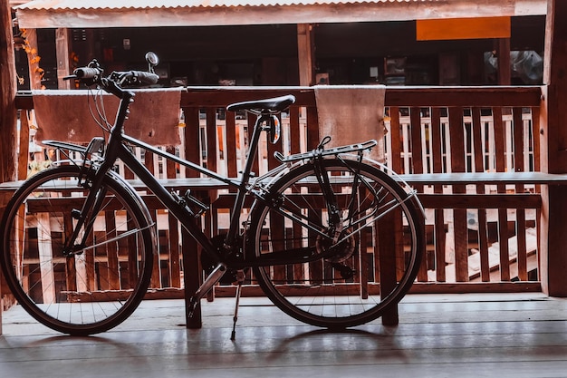 Bicycle parked by bench