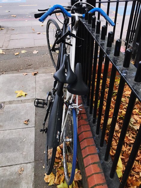 Bicycle parked on sidewalk in city