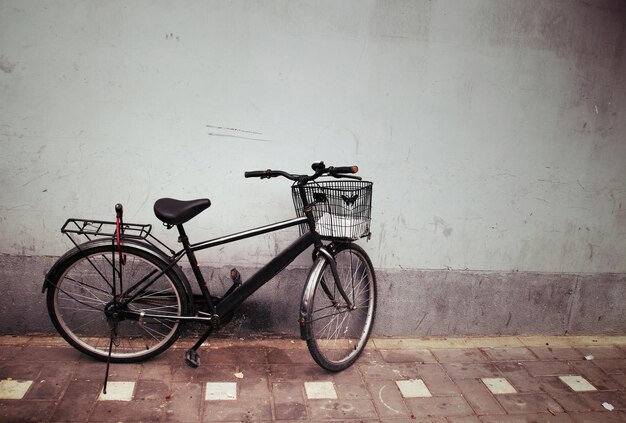 Bicycle parked on wall