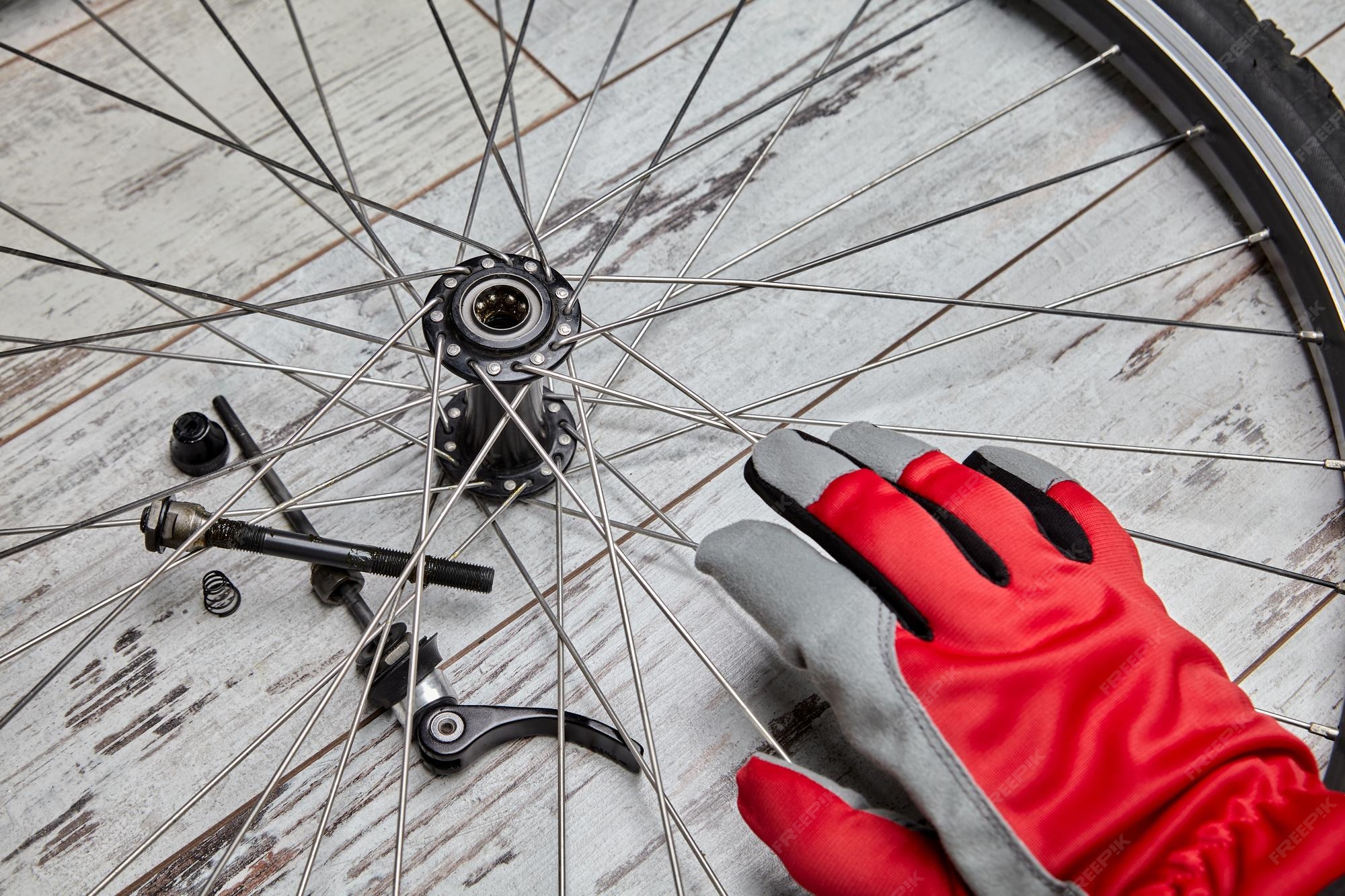 Premium Photo Bicycle repair disassembly and lubrication oil of bicycle wheel bearings