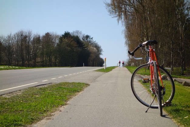 bicycle on road against clear sky