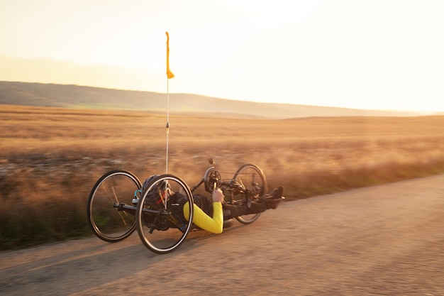 bicycle on road against sky during sunset