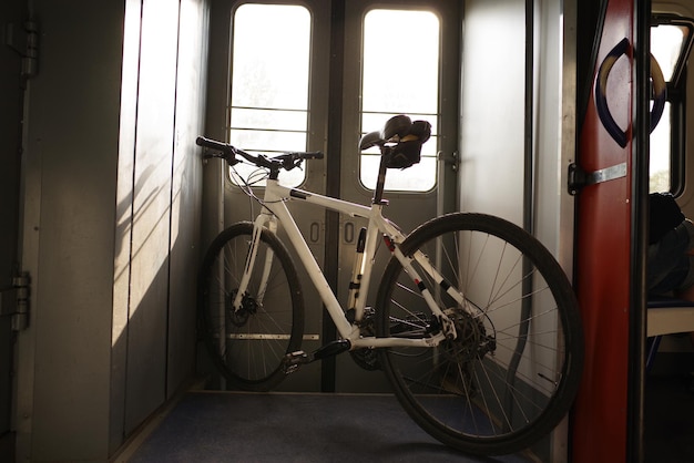 Bicycle standing in the vestibule Tourism with a bicycle Transport the bike on the train Travel with a bike