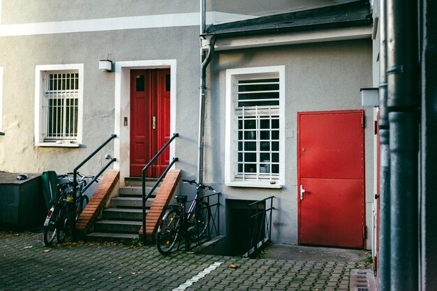 Bicycles by steps against house