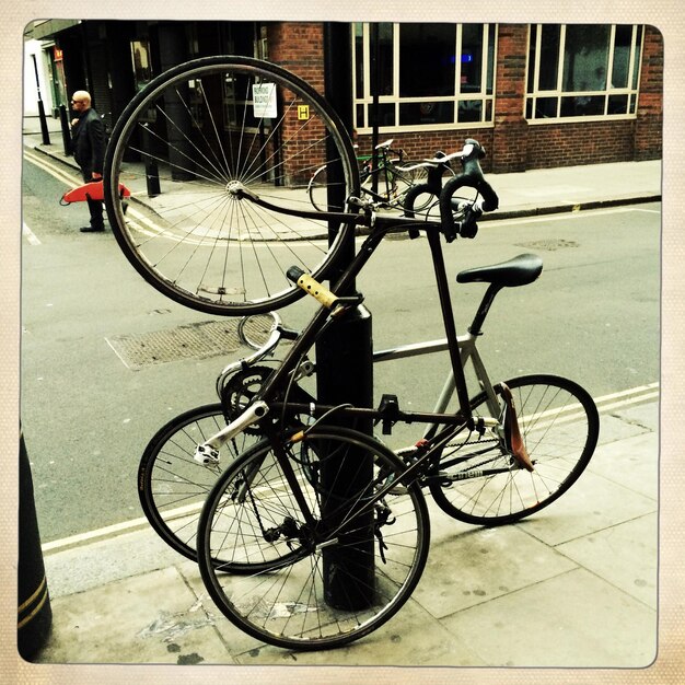 Photo bicycles chained by pole