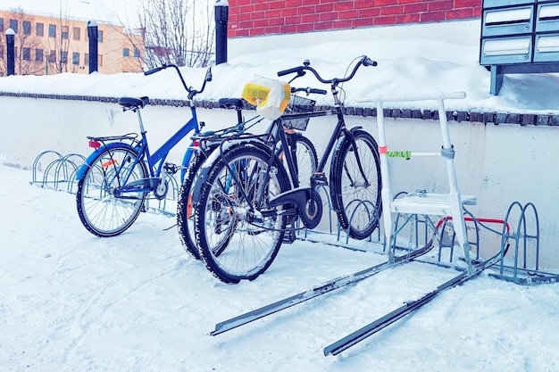 Bicycles parked in the snowy street in winter Rovaniemi, Lapland, Finland.