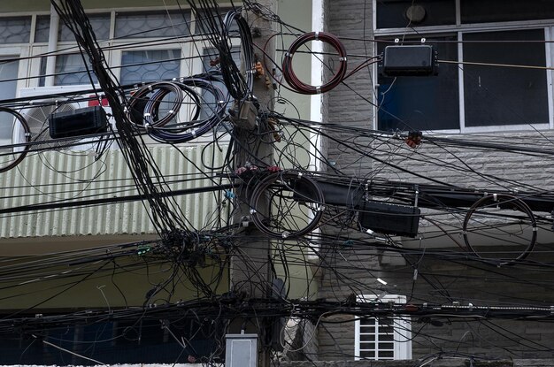 Bicycles on pole against buildings