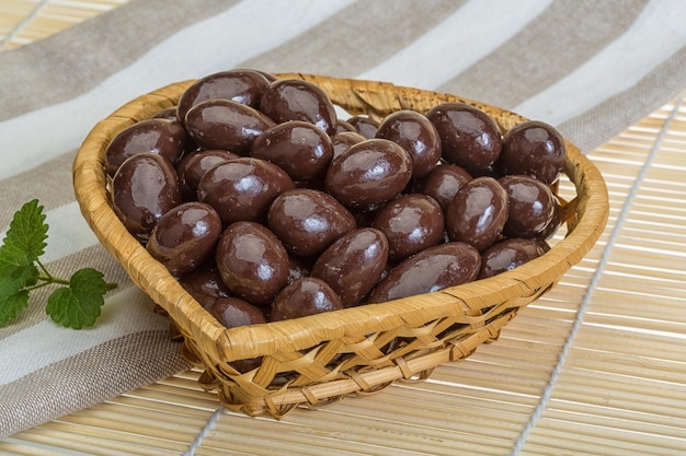 Big Almond in chocolate on the bowl