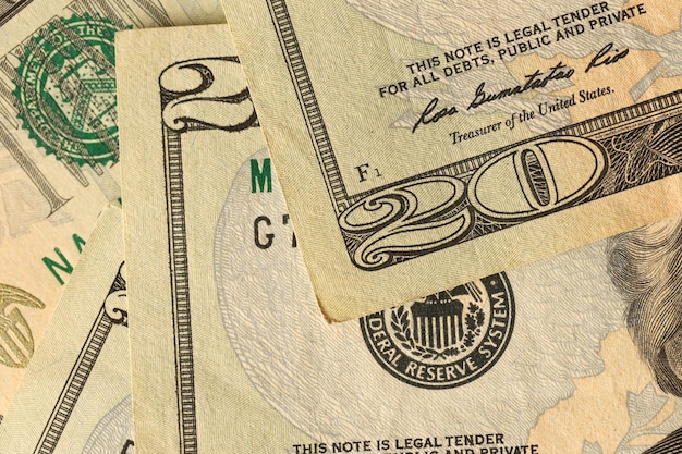 Big amount of old 20 dollar bills details on macro photography\
money earnings payday or tax paying period