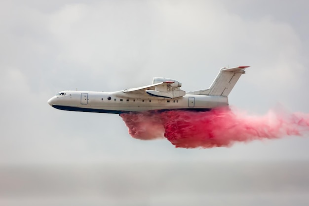 Big amphibious fire aircraft drops water