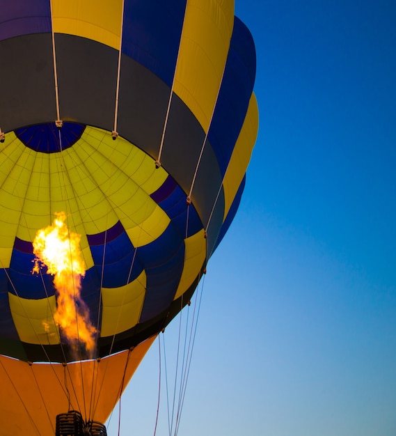 Big balloon flies against the sky