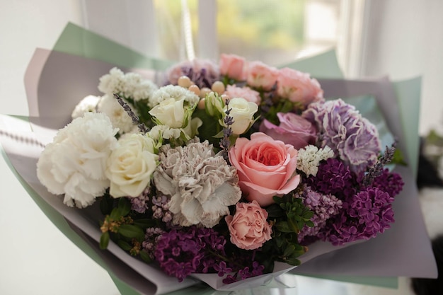 Big beautiful bouquet with gray dianthus and peony roses