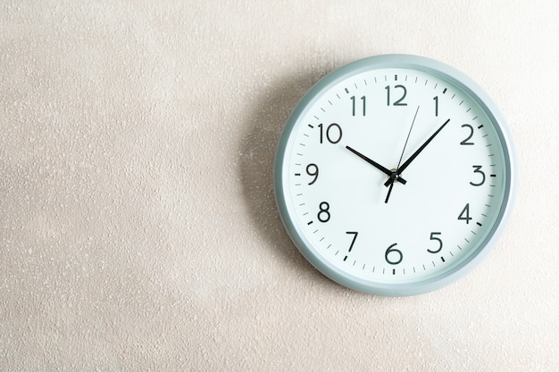 big beautiful clock hanging on color, space for text