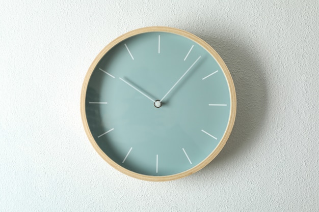 Big beautiful stylish clock hanging on light, space for text