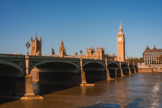 Big Ben Westminster Bridge on River Thames in London the UK English symbol Lovely puffy clouds sunny day