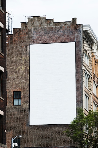 Photo big billboard template on building in city