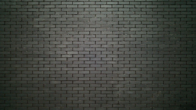 big black wall made of bricks. black bricks texture
