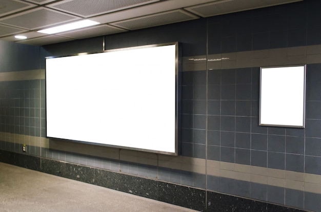 Photo big blank advertising billboard on wall with copy space in subway train station or airport