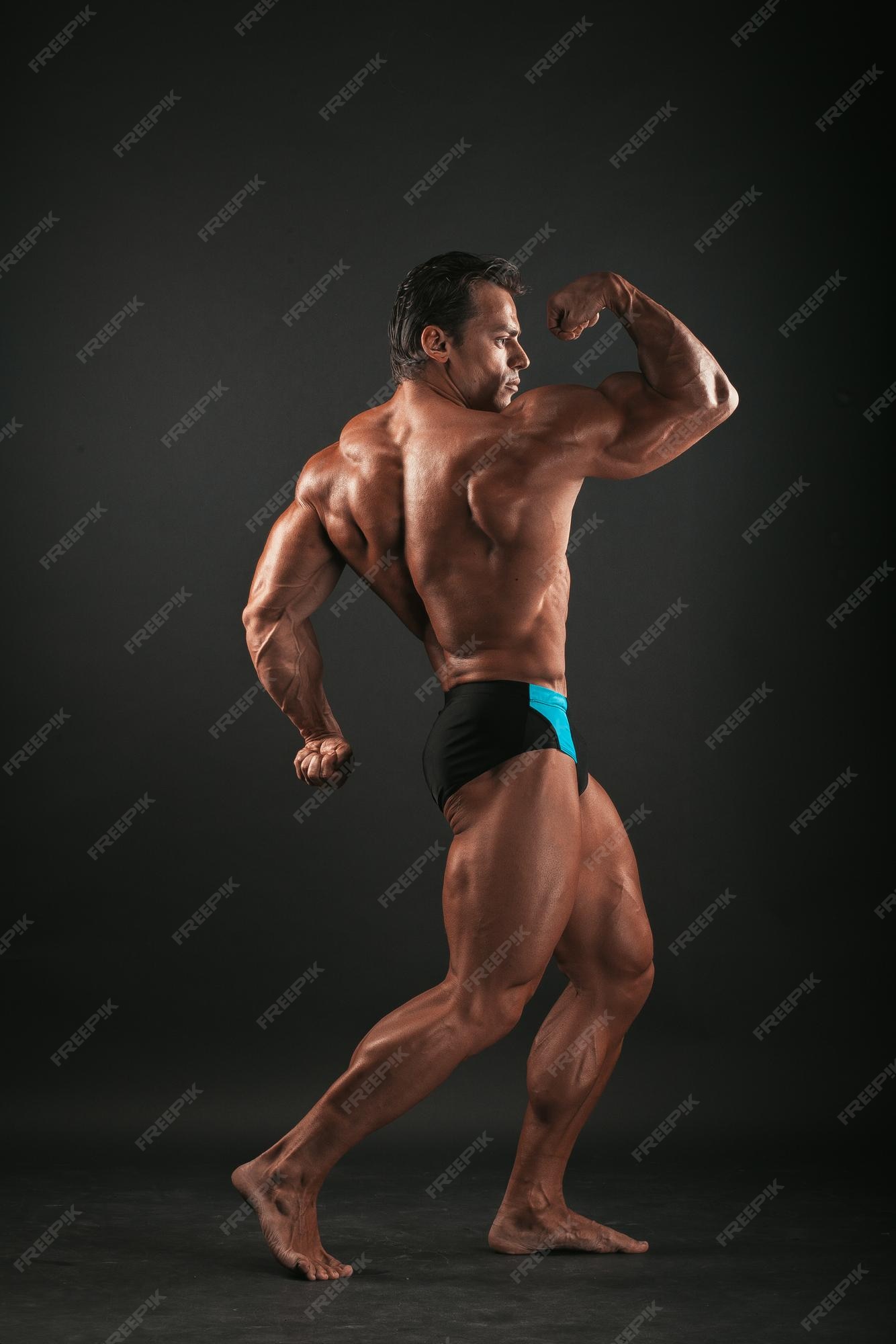 Premium Photo | Big bodybuilder on black
