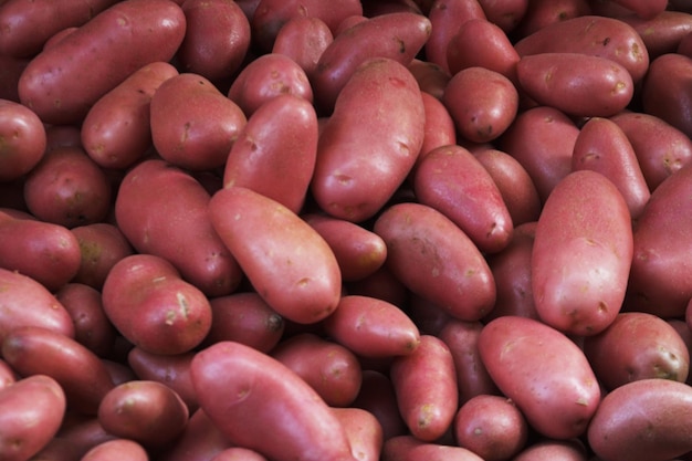 Big bunch of natural potatoes at market