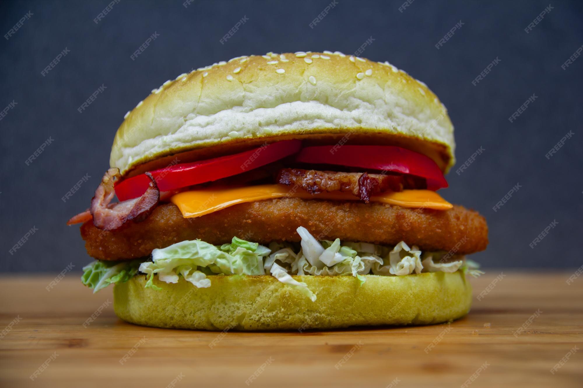 Premium Photo | Big burger with bacon on a blue background