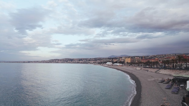 Big city and a long coastline in Nice France drone shot