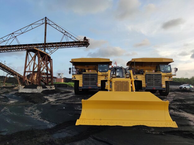 Big dump truck and excavator in the coal mine