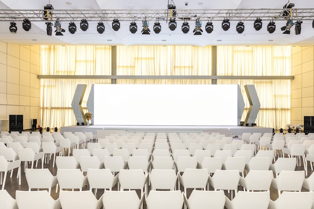 Big empty modern seminar, conference hall with projector screen