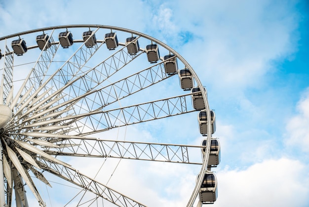 Big ferris wheel in the old town of Gdansk blu sky background