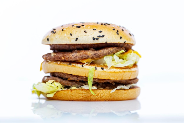 Big hamburger Delicious junk food and quick snack White background with reflection