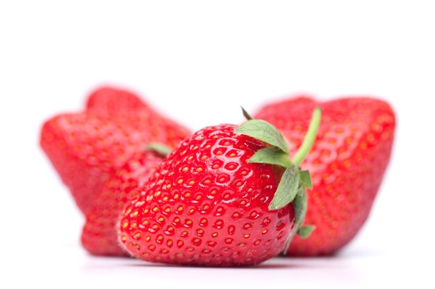 Big handful of strawberries isolated