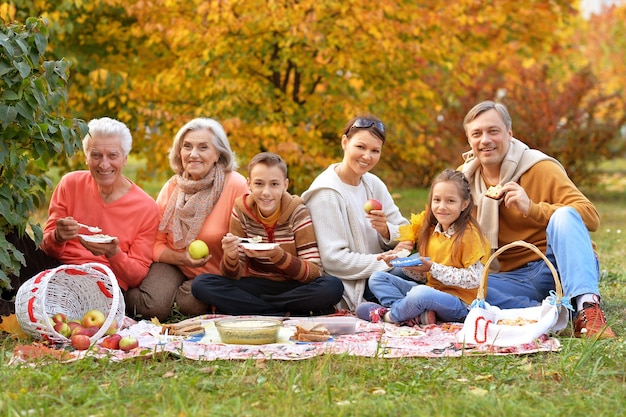 Big happy family on picnic in autumn