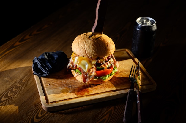 Big juicy burger on a cutting board