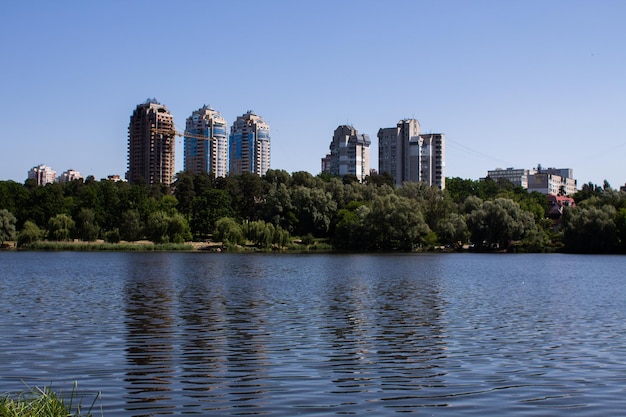 Big lake in the park against of the city