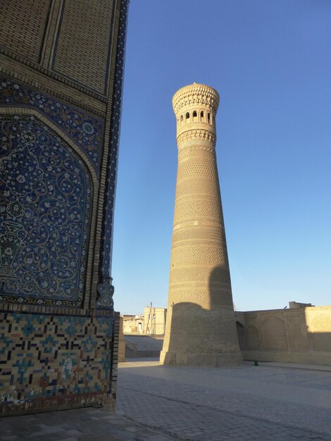 Big minaret in Bukhara against the sky