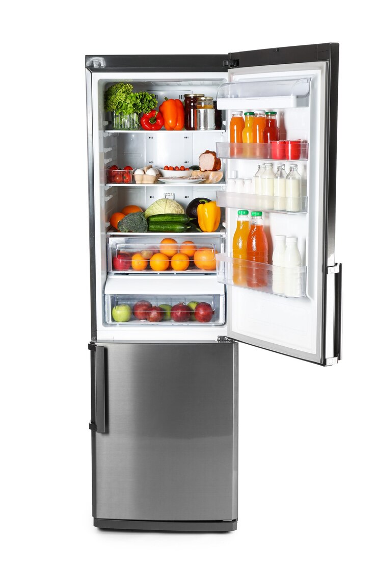 Photo big modern fridge with fresh products on white background