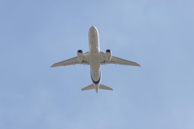 Big passenger plane flying in the blue sky