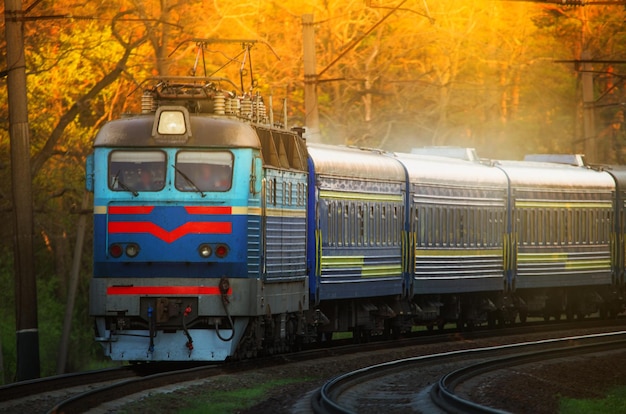 Big passenger train at dawn, selective focus