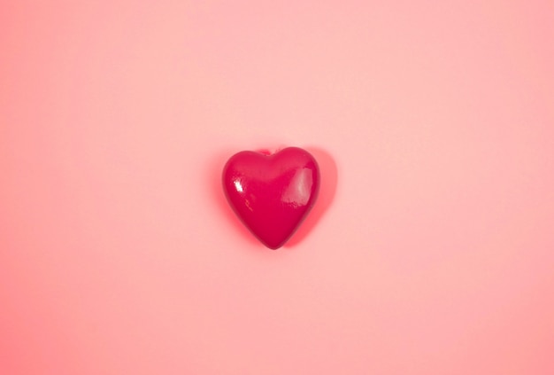 Photo big pink heart on pink backround. love concept