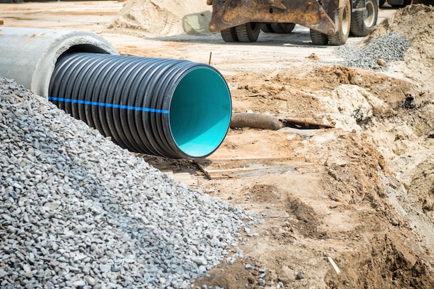 Big pipe or tube for water sewer on construction site during road repair