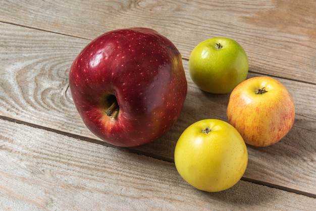 Big red apple on wooden table