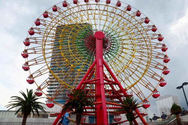 Big red ferris wheels forl people play at Kobe Harborland on July 9 2015 in Kobe Japan