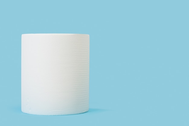 A big roll of paper towels on a blue background